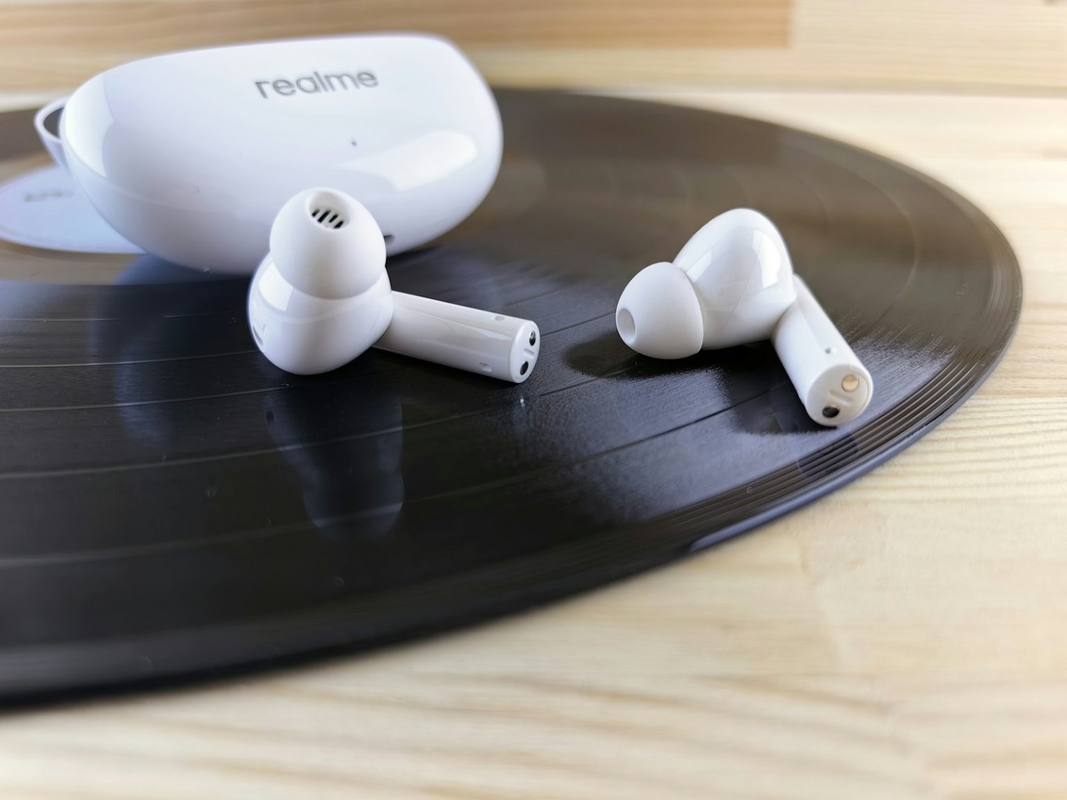 Bluetooth Sounding Enhances Device Security and Accuracy a pair of headphones sitting on top of a record